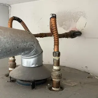 Natural gas water heater with flex lines and ball valve