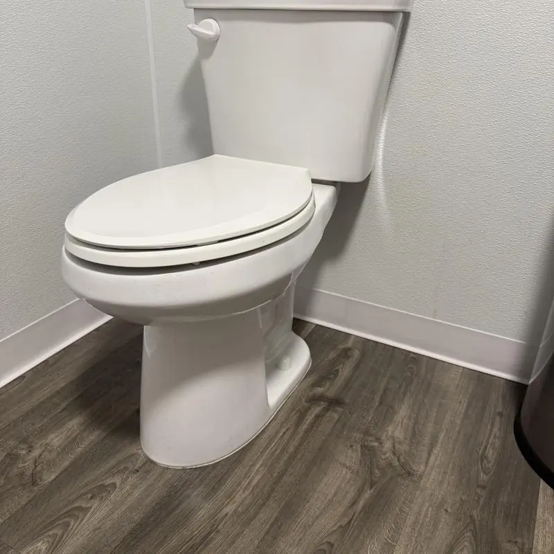 Western Pottery elongated toilet with PVC baseboard