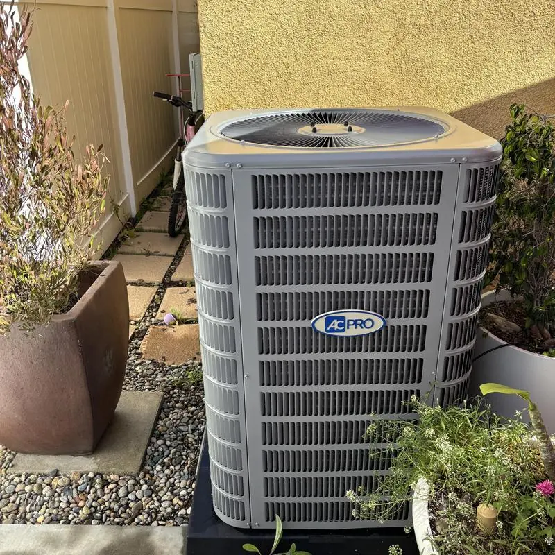 AC Pro condenser unit with outdoor maintenance in yard