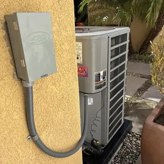 AC Pro condenser unit with electrical disconnect box