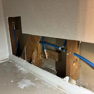 Cold water line reroute behind drywall in garage