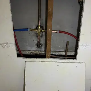 Master bathroom shower valve hot water re-route pipes