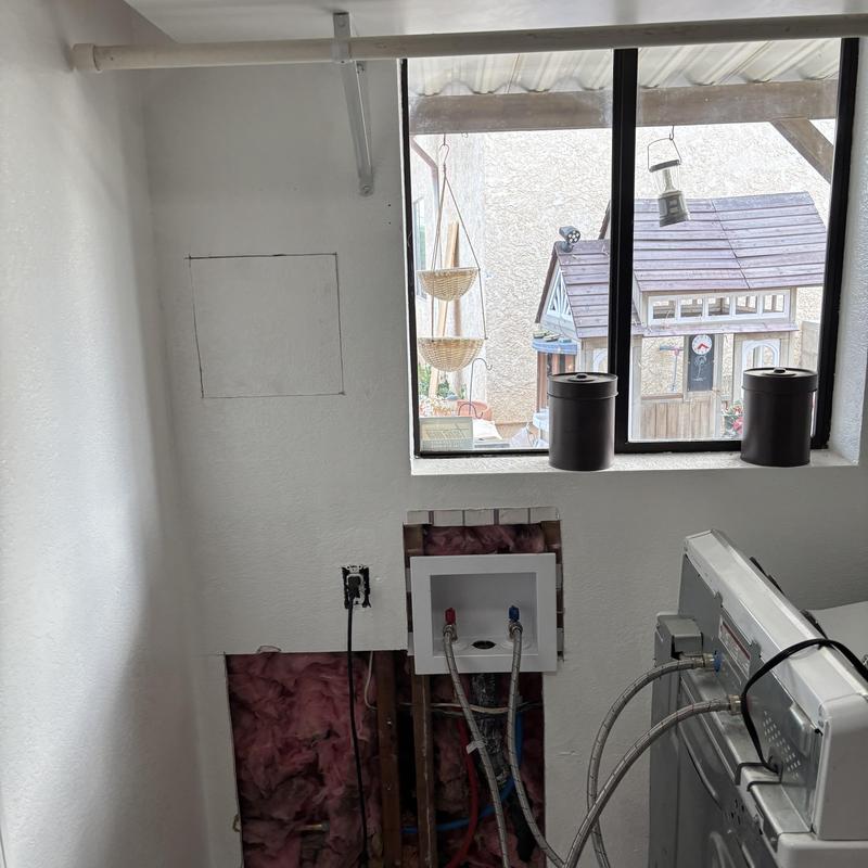 Hot and cold water lines reroute in laundry room wall