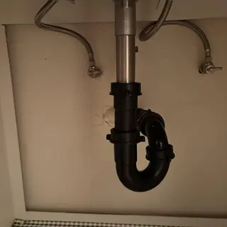 Sink drain trap with angle stop valves and supply lines