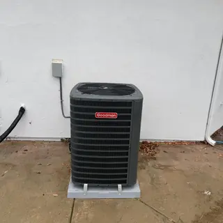 Goodman 3 ton R32 air conditioner on concrete pad