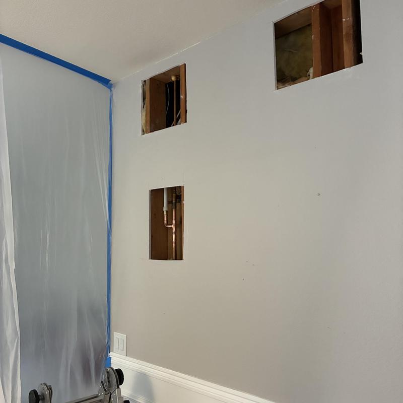 Copper hot water pipes reroute in wall cutouts