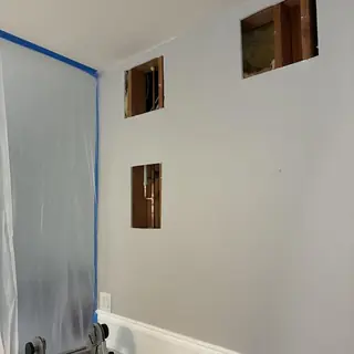 Copper hot water pipes reroute in wall cutouts