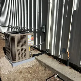 Innovair 20 SEER heat pump unit outside building
