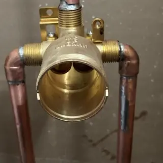 Shower valve with attached copper piping installed