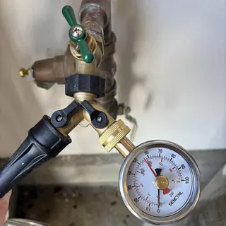 Pressure regulator valve with gauge at 55 psi measurement