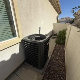 Goodman 3 ton AC unit on concrete pad outside