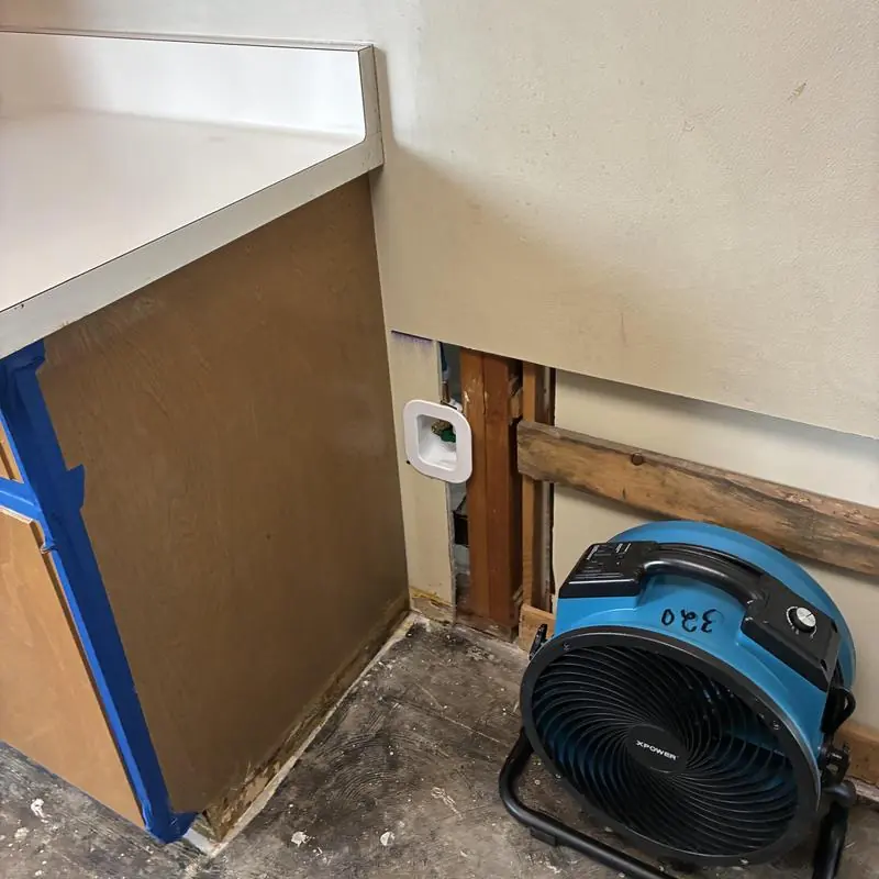 Cold water supply line behind wall with drying fan