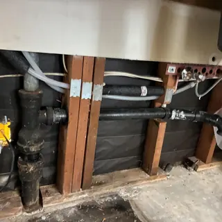 Cold water pipe and drainage system inside wall framing