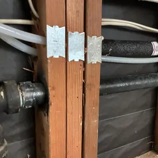 Cold water pipe leak behind wall framing in home