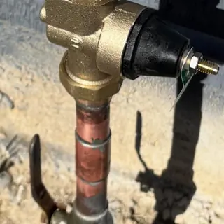 Water pressure regulator and copper pipe after installation