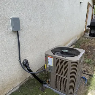 Innovair outdoor condenser unit with disconnect installed on pad