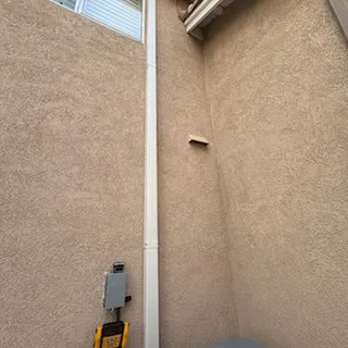 New line set cover installed on exterior wall